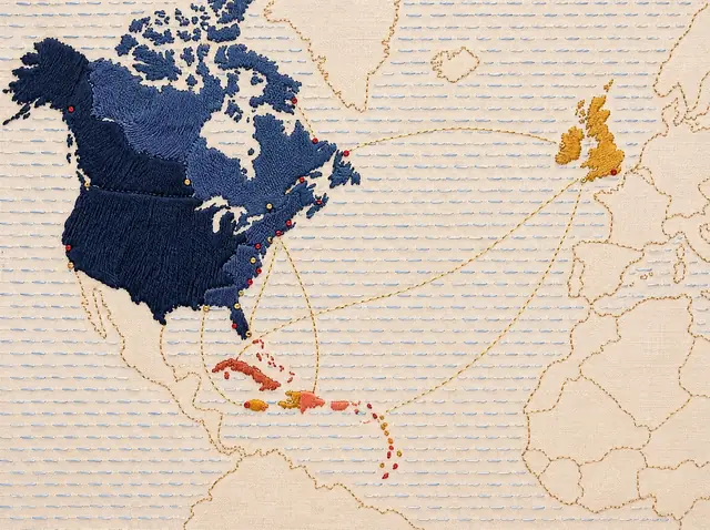 An embroidered map of the North Atlantic: the United States and Canada in navy thread, the Caribbean islands in terracotta and saffron, Britain and Ireland in gold, and fine gold stitches arcing across the ocean between them.
